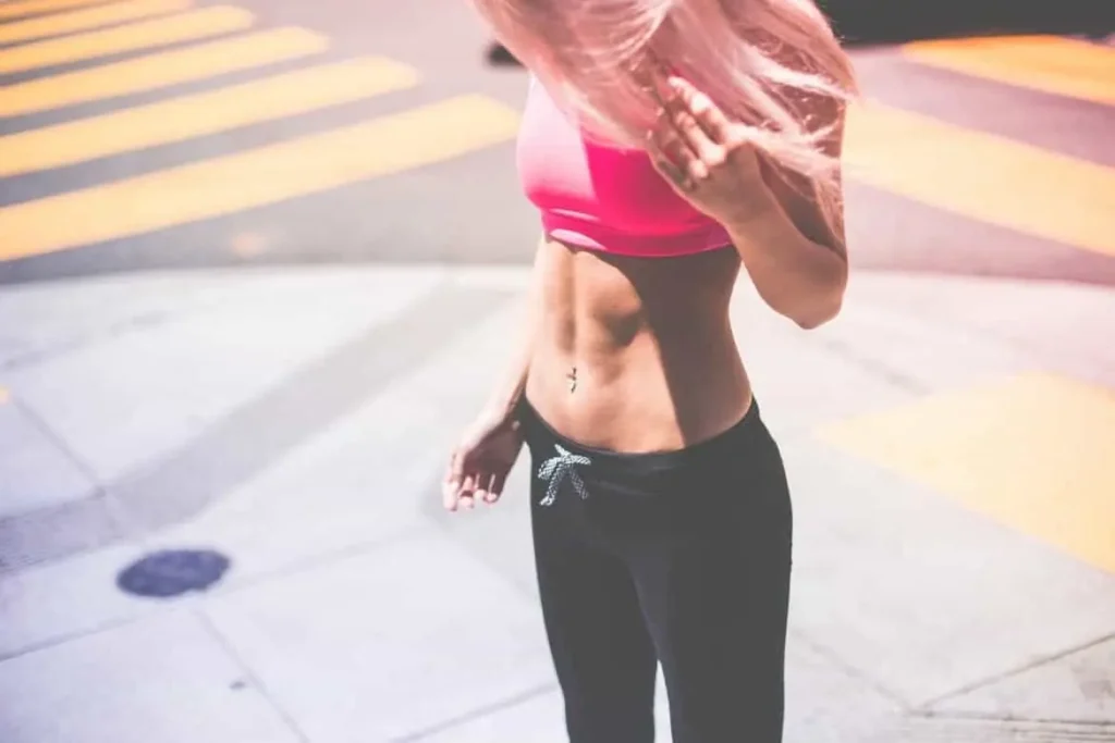 Woman with toned stomach after LA-EMS Body Sculpting Treatment Southall